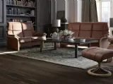 Divano lineare dalle linee arrotondate con imbottitura morbida e finiture in legno pregiato Eldorado High Back di Stressless